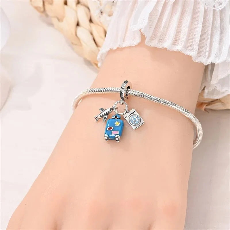 Amarante Jewelry Plane, Passport and Blue Suitcase Triple Dangle Charm