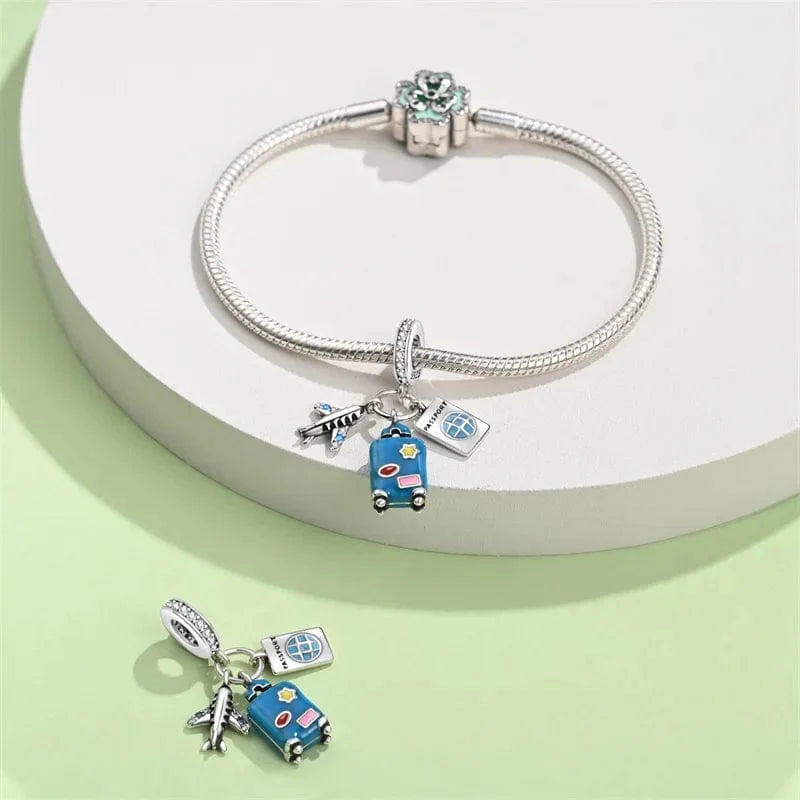 Amarante Jewelry Plane, Passport and Blue Suitcase Triple Dangle Charm